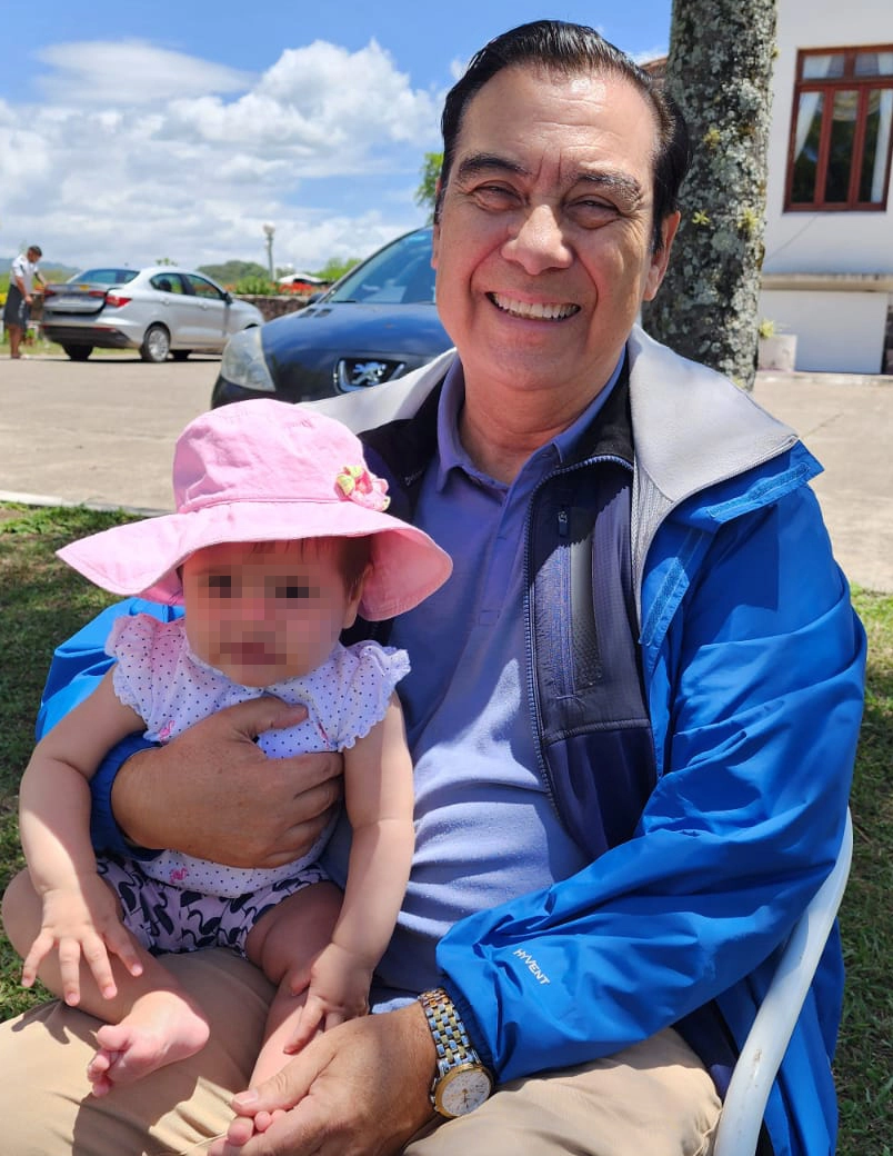 Henry with his granddaughter on vacation
